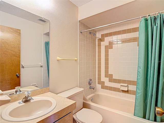 10139 Carrin Rd, Spring Hill, FL 34608 - bathroom featuring shower / tub combo with curtain, vanity, and toilet