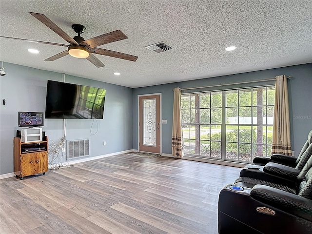 11340 Corinthian St, Spring Hill, FL 34609 - living room with wood finished floors, baseboards, recessed lighting, a ceiling fan, and a textured ceiling