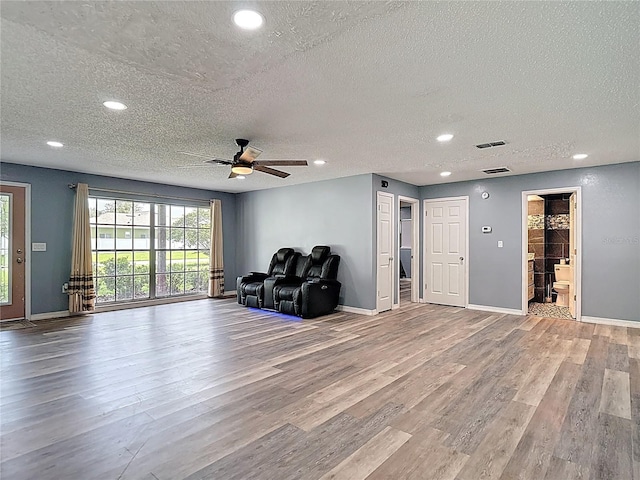 11340 Corinthian St, Spring Hill, FL 34609 - unfurnished room featuring a textured ceiling, wood finished floors, recessed lighting, ceiling fan, and baseboards