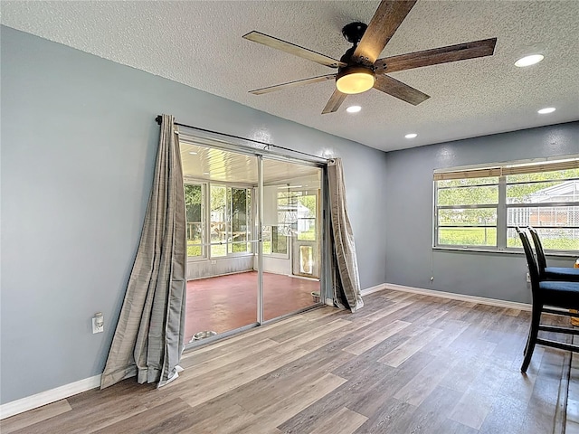 11340 Corinthian St, Spring Hill, FL 34609 - unfurnished office featuring a textured ceiling, ceiling fan, wood finished floors, healthy amount of natural light, and recessed lighting