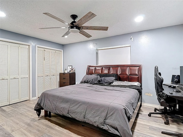 11340 Corinthian St, Spring Hill, FL 34609 - bedroom featuring wood finished floors, recessed lighting, an office area, a ceiling fan, and multiple closets