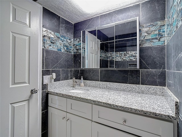 11340 Corinthian St, Spring Hill, FL 34609 - bathroom with vanity, tile walls, and decorative backsplash