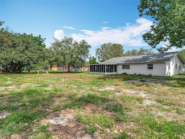 11340 Corinthian St, Spring Hill, FL 34609 - view of yard featuring a sunroom