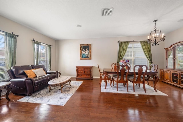 17905 Machair Ln, Land O Lakes, FL 34638 - living area featuring dark wood-style floors, a chandelier, and baseboards