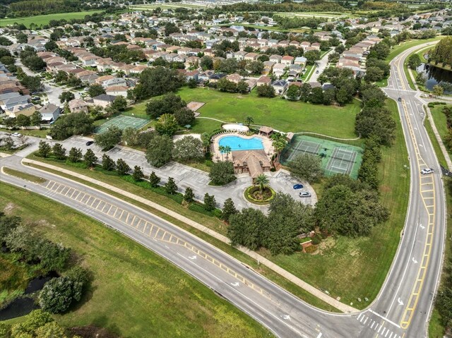 17905 Machair Ln, Land O Lakes, FL 34638 - aerial view of property and surrounding area with a main thoroughfare, a pool area, and nearby suburban area