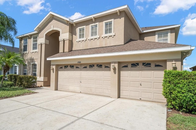 17905 Machair Ln, Land O Lakes, FL 34638 - view of front facade featuring concrete driveway, stucco siding, and an attached garage