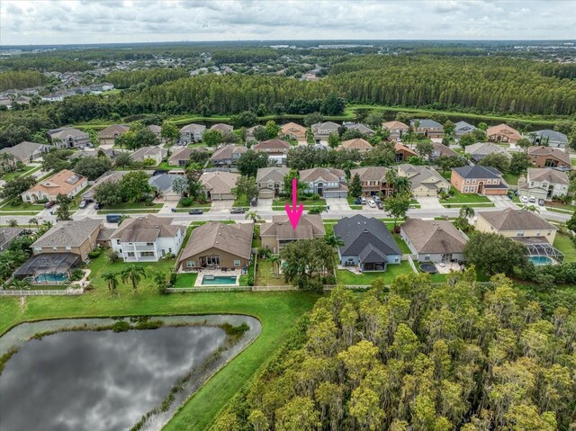 17905 Machair Ln, Land O Lakes, FL 34638 - aerial overview of property's location with a nearby body of water, a heavily wooded area, and nearby suburban area