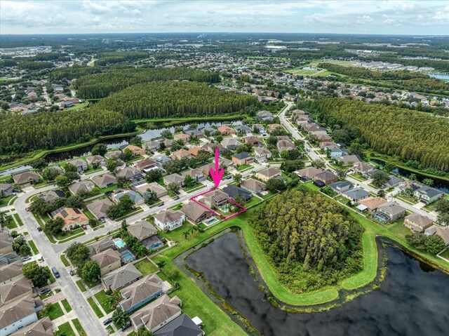 17905 Machair Ln, Land O Lakes, FL 34638 - aerial perspective of suburban area with a nearby body of water and property parcel outlined