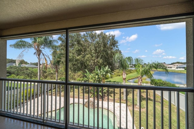 17905 Machair Ln, Land O Lakes, FL 34638 - unfurnished sunroom featuring a water view