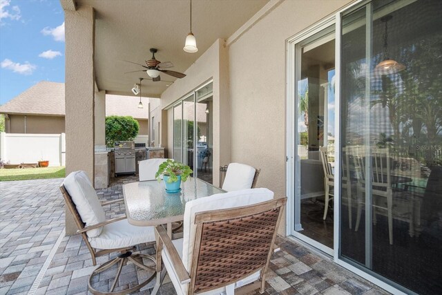 17905 Machair Ln, Land O Lakes, FL 34638 - view of patio / terrace with ceiling fan, outdoor dining area, and area for grilling