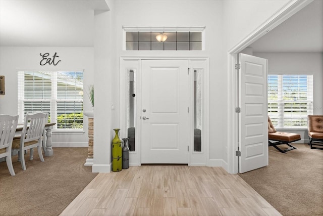 11042 Heth Ct, Weeki Wachee, FL 34613 - foyer with baseboards and light wood finished floors