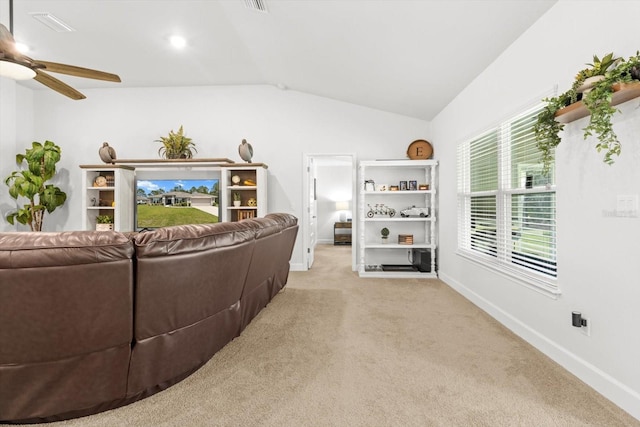 11042 Heth Ct, Weeki Wachee, FL 34613 - carpeted living area with lofted ceiling, baseboards, and ceiling fan