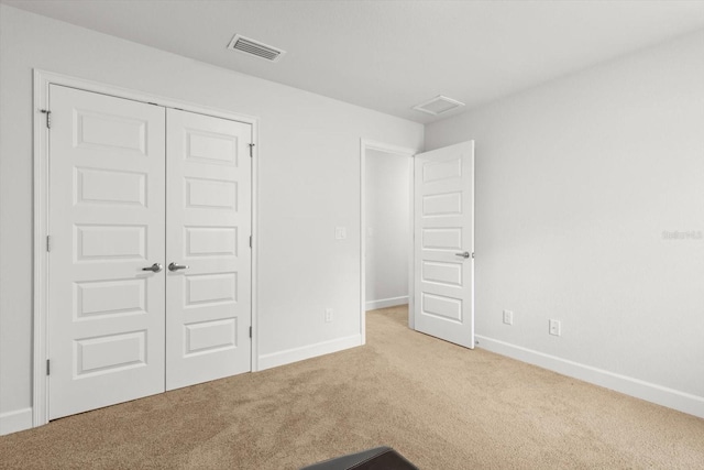 11042 Heth Ct, Weeki Wachee, FL 34613 - unfurnished bedroom with carpet flooring, baseboards, and a closet