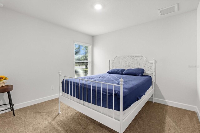 11042 Heth Ct, Weeki Wachee, FL 34613 - bedroom featuring carpet and baseboards