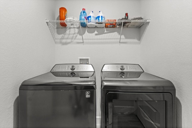 11042 Heth Ct, Weeki Wachee, FL 34613 - laundry room featuring washer and dryer