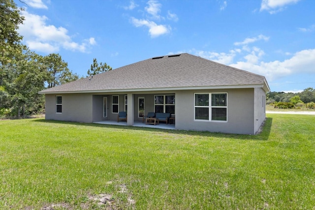 11042 Heth Ct, Weeki Wachee, FL 34613 - back of property with stucco siding, roof with shingles, a patio area, and a yard