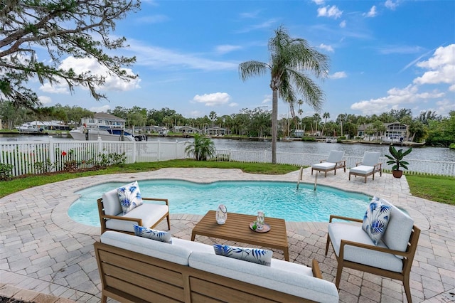 5440 Manatee Point Dr, New Port Richey, FL 34652 - view of swimming pool featuring an outdoor hangout area, a patio, a water view, and a fenced backyard