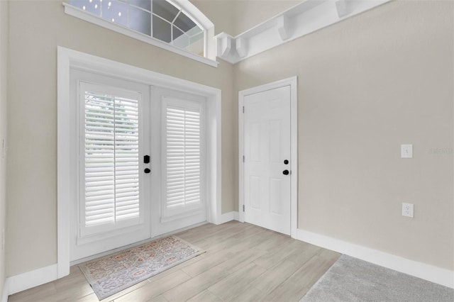 5440 Manatee Point Dr, New Port Richey, FL 34652 - foyer with light wood-type flooring and baseboards