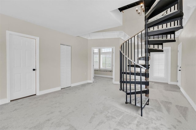 5440 Manatee Point Dr, New Port Richey, FL 34652 - stairway with carpet flooring, baseboards, and a chandelier
