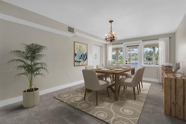 5440 Manatee Point Dr, New Port Richey, FL 34652 - dining space featuring baseboards, a chandelier, and carpet flooring