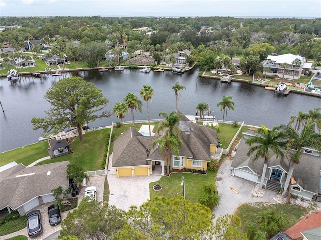 5440 Manatee Point Dr, New Port Richey, FL 34652 - aerial perspective of suburban area featuring a large body of water