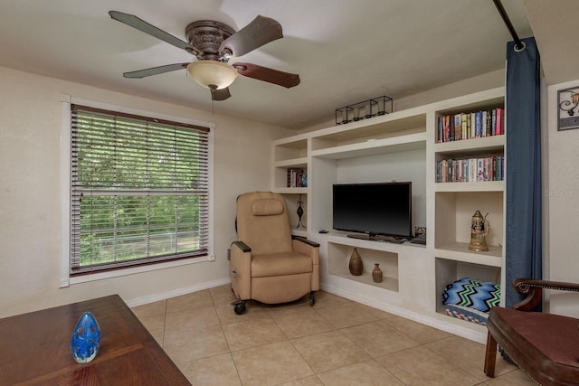 3140 Bahia Ave, Holiday, FL 34690 - sitting room with a ceiling fan, built in features, light tile patterned floors, and baseboards