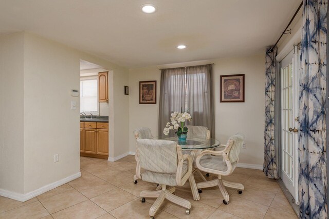 3140 Bahia Ave, Holiday, FL 34690 - dining space with light tile patterned floors, baseboards, and recessed lighting