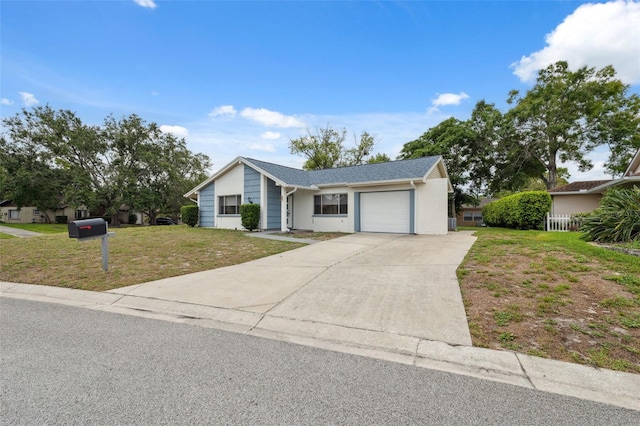 13001 Sawmill Way, Hudson, FL 34667 - view of front facade with a garage, concrete driveway, and a front lawn