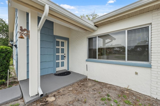 13001 Sawmill Way, Hudson, FL 34667 - doorway to property featuring brick siding