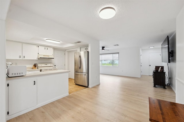 13001 Sawmill Way, Hudson, FL 34667 - kitchen with white appliances, range hood, a ceiling fan, and light wood-type flooring