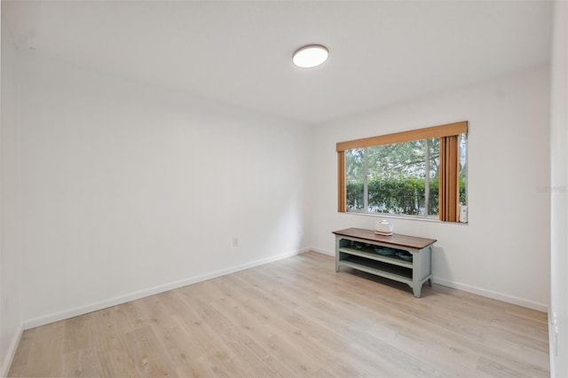 13001 Sawmill Way, Hudson, FL 34667 - empty room with light wood-type flooring and baseboards