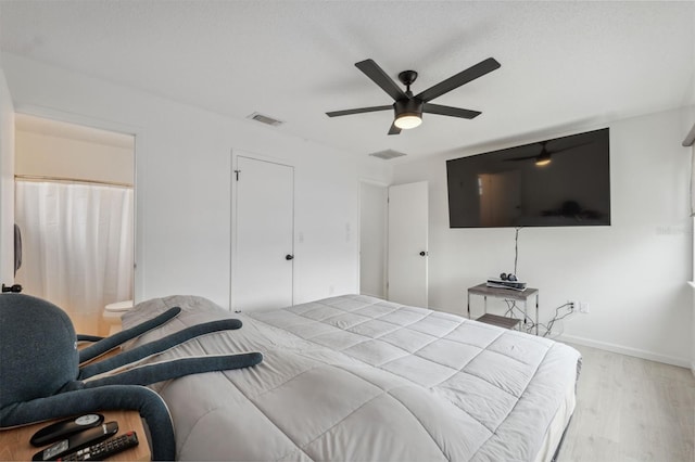 13001 Sawmill Way, Hudson, FL 34667 - bedroom with wood finished floors, a ceiling fan, and baseboards