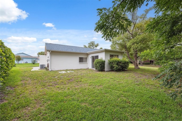 13001 Sawmill Way, Hudson, FL 34667 - view of grassy yard featuring cooling unit