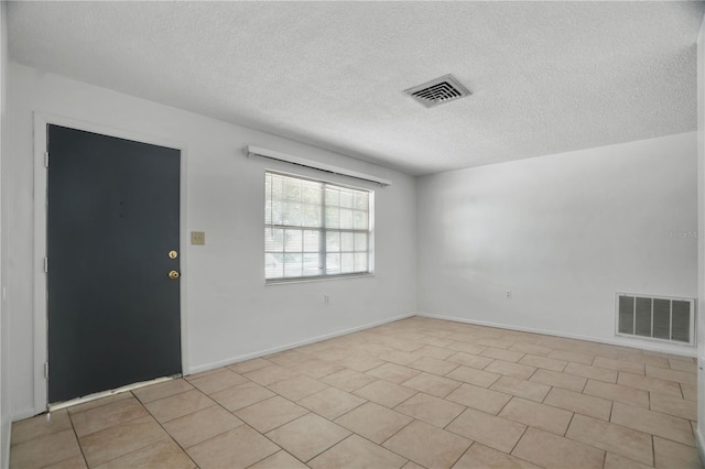 8053 Dedham Dr, Port Richey, FL 34668 - unfurnished room featuring a textured ceiling