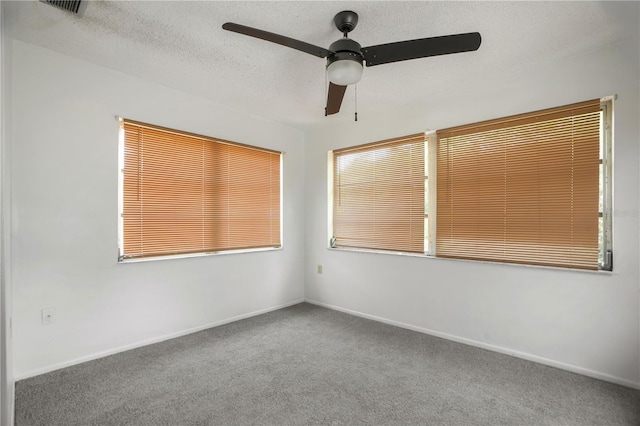 8053 Dedham Dr, Port Richey, FL 34668 - carpeted spare room featuring a ceiling fan and baseboards