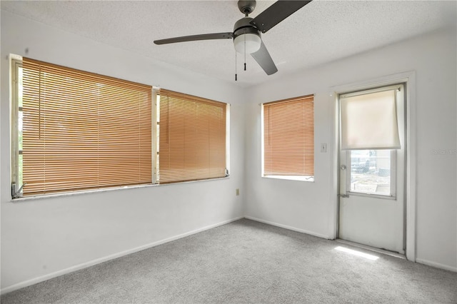 8053 Dedham Dr, Port Richey, FL 34668 - unfurnished room featuring carpet floors, ceiling fan, a textured ceiling, and baseboards