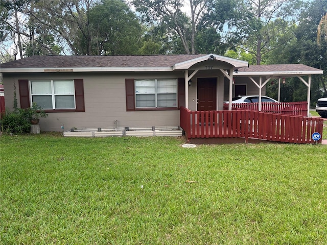 717 Whiteway Dr, Brooksville, FL 34601 - view of front of home with a front lawn and roof with shingles