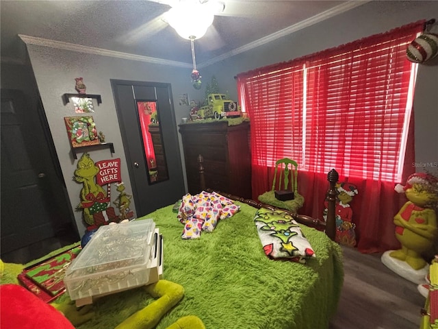 717 Whiteway Dr, Brooksville, FL 34601 - bedroom with wood finished floors, crown molding, and a ceiling fan