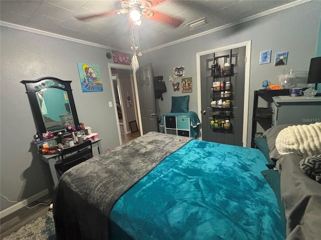 717 Whiteway Dr, Brooksville, FL 34601 - bedroom with crown molding, a ceiling fan, and wood finished floors