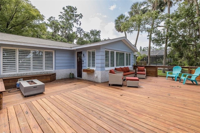 7424 Grand Blvd, New Port Richey, FL 34652 - wooden terrace featuring an outdoor living space with a fire pit