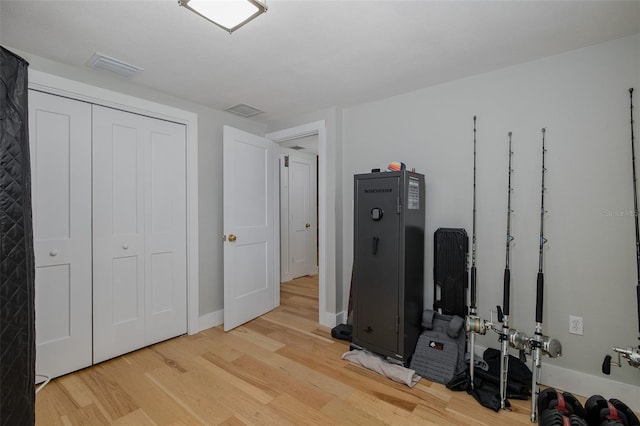 7424 Grand Blvd, New Port Richey, FL 34652 - bedroom featuring wood finished floors, a closet, and baseboards