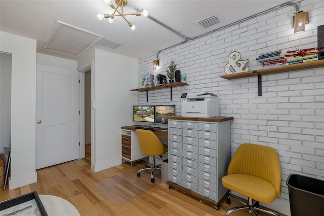 7424 Grand Blvd, New Port Richey, FL 34652 - office space featuring wood finished floors, brick wall, and baseboards