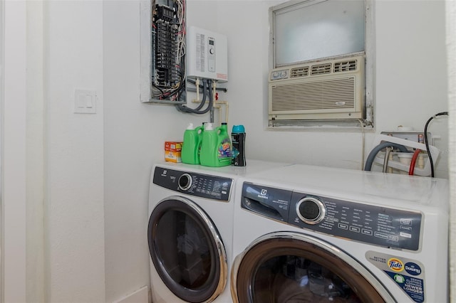 7424 Grand Blvd, New Port Richey, FL 34652 - laundry room featuring washing machine and clothes dryer, tankless water heater, and a wall mounted AC