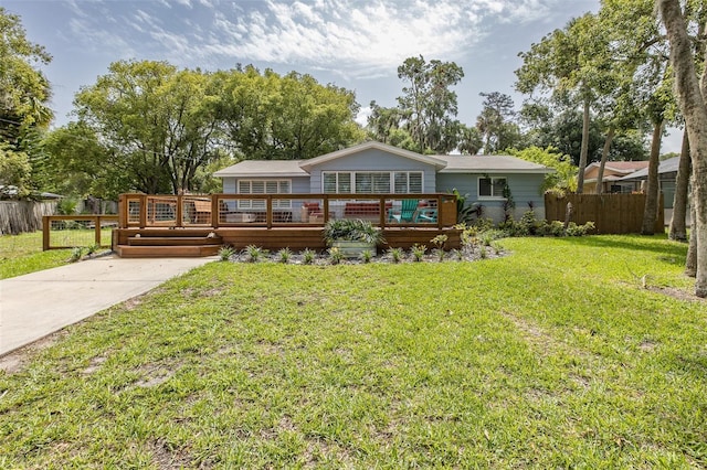 7424 Grand Blvd, New Port Richey, FL 34652 - back of house featuring a wooden deck and concrete driveway