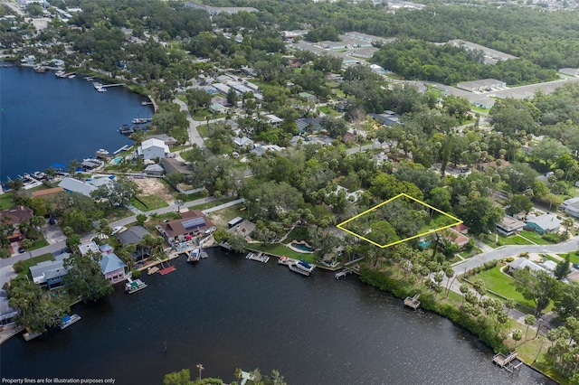 7424 Grand Blvd, New Port Richey, FL 34652 - aerial perspective of suburban area with a nearby body of water and property parcel outlined