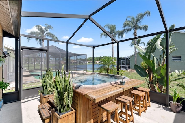 7923 Woburn St, New Port Richey, FL 34653 - view of pool with a patio area, a hot tub, glass enclosure, and a water view
