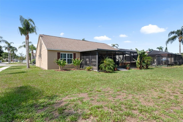 7923 Woburn St, New Port Richey, FL 34653 - rear view of house featuring a yard and stucco siding