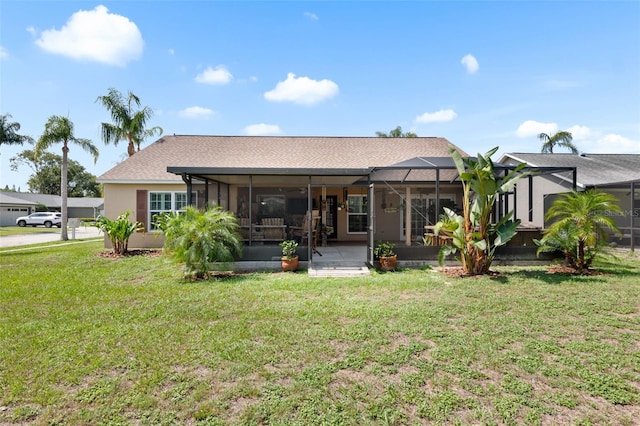 7923 Woburn St, New Port Richey, FL 34653 - rear view of property featuring a lawn, glass enclosure, and roof with shingles