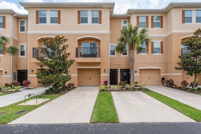 5520 White Marlin Ct, New Port Richey, FL 34652 - multi unit property with stucco siding, a garage, and concrete driveway
