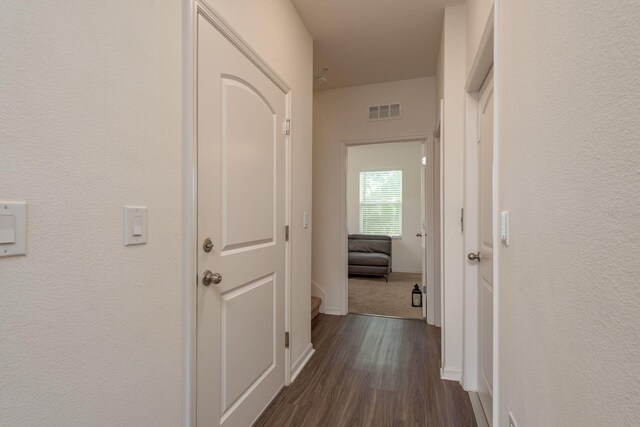 5520 White Marlin Ct, New Port Richey, FL 34652 - corridor featuring dark wood-style flooring and baseboards
